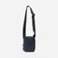 A studio shot of the Shoulder Bag in Midnight Blue hanging from the strap