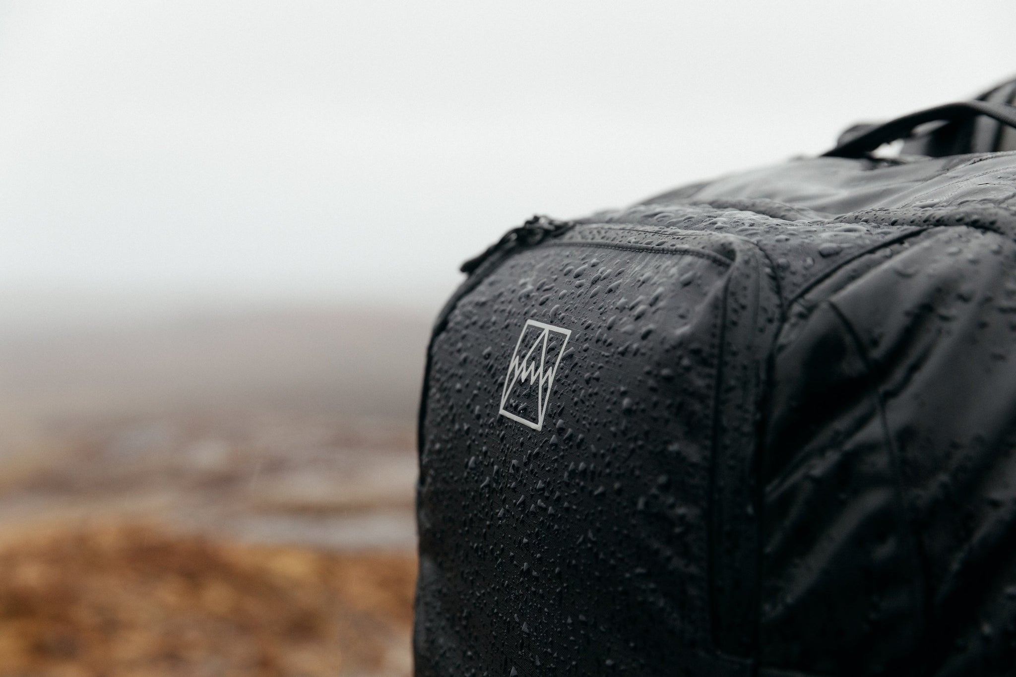 Black backpack in the rain