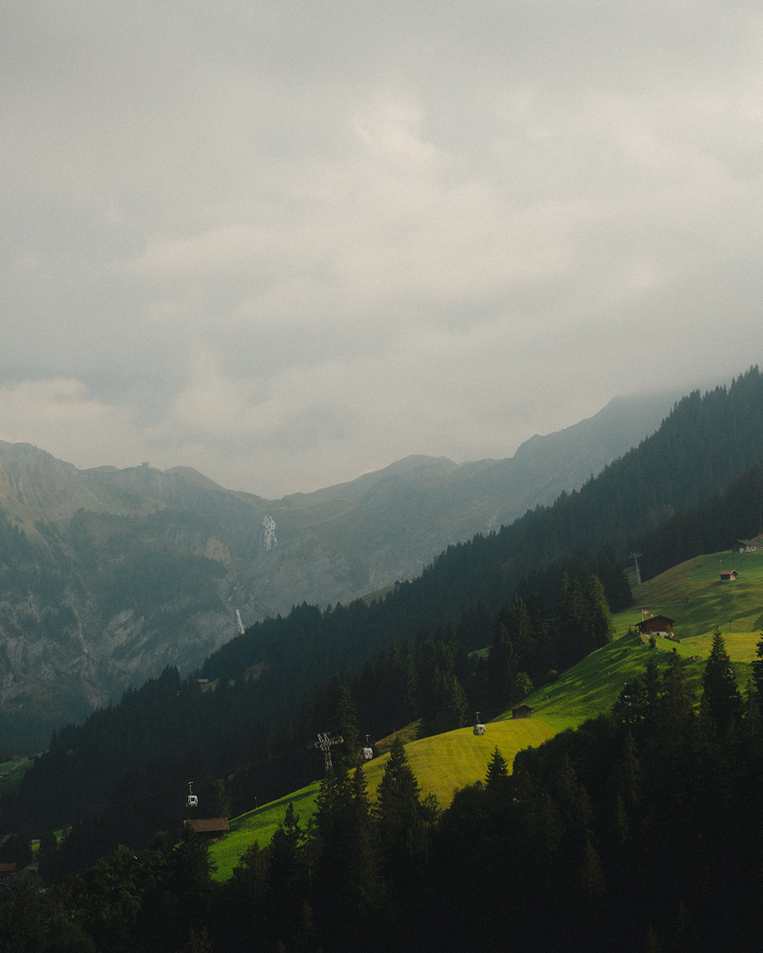 Mountain landscape with green valleys and misty peaks