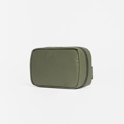 A studio shot of the front of the tech bag in Urban Green