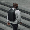 Man wearing All Black Everyday Backpack