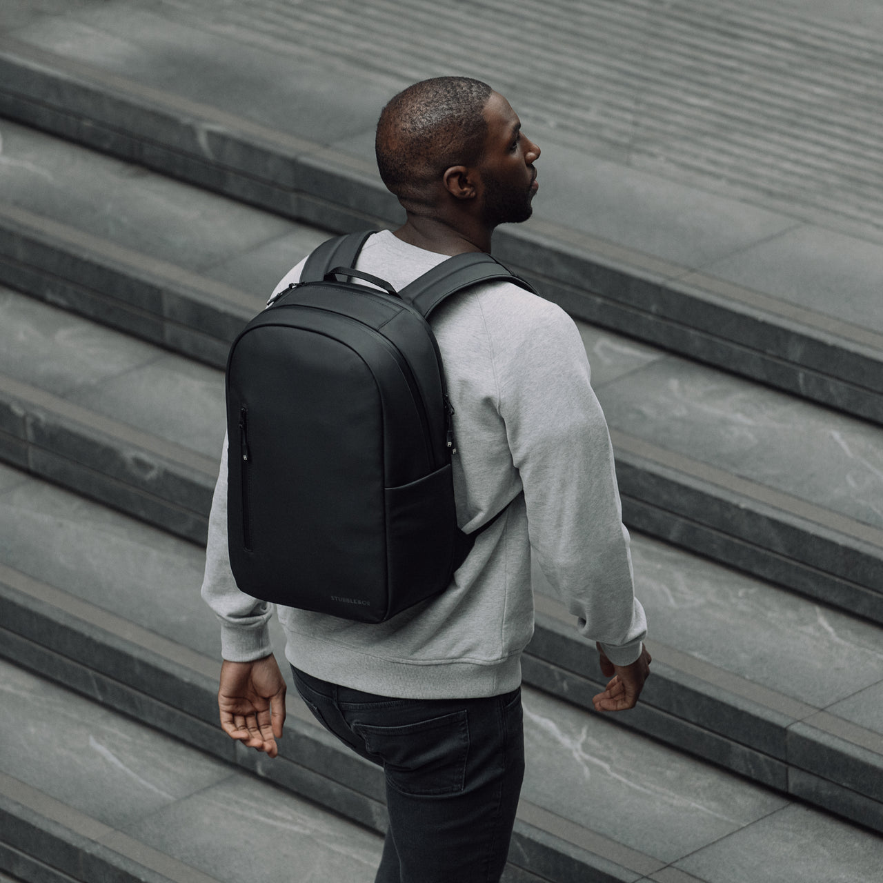 Man wearing All Black Everyday Backpack