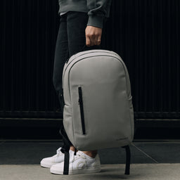 The Everyday Backpack in Concrete being carried