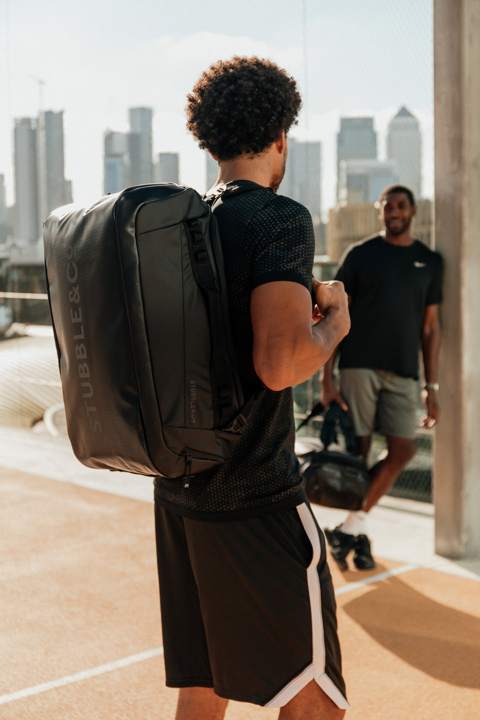 Man wearing The Kit Bag at a basketball court