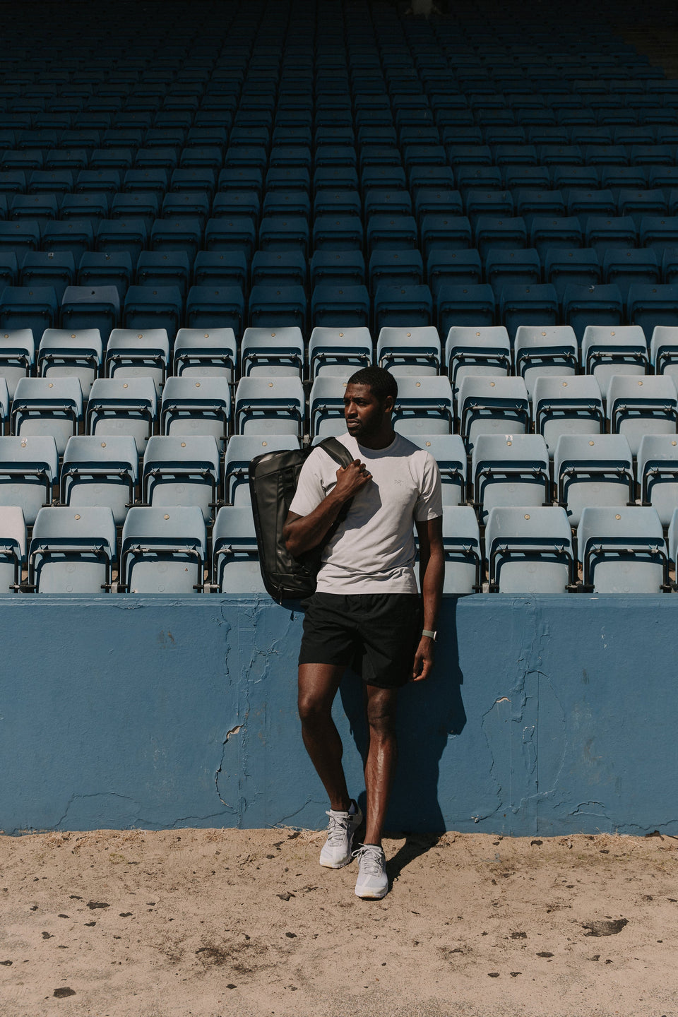 Man wearing The Kit Bag at a running track