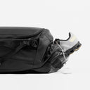 The Kit Bag All Black Backpack shoe pocket open at the end