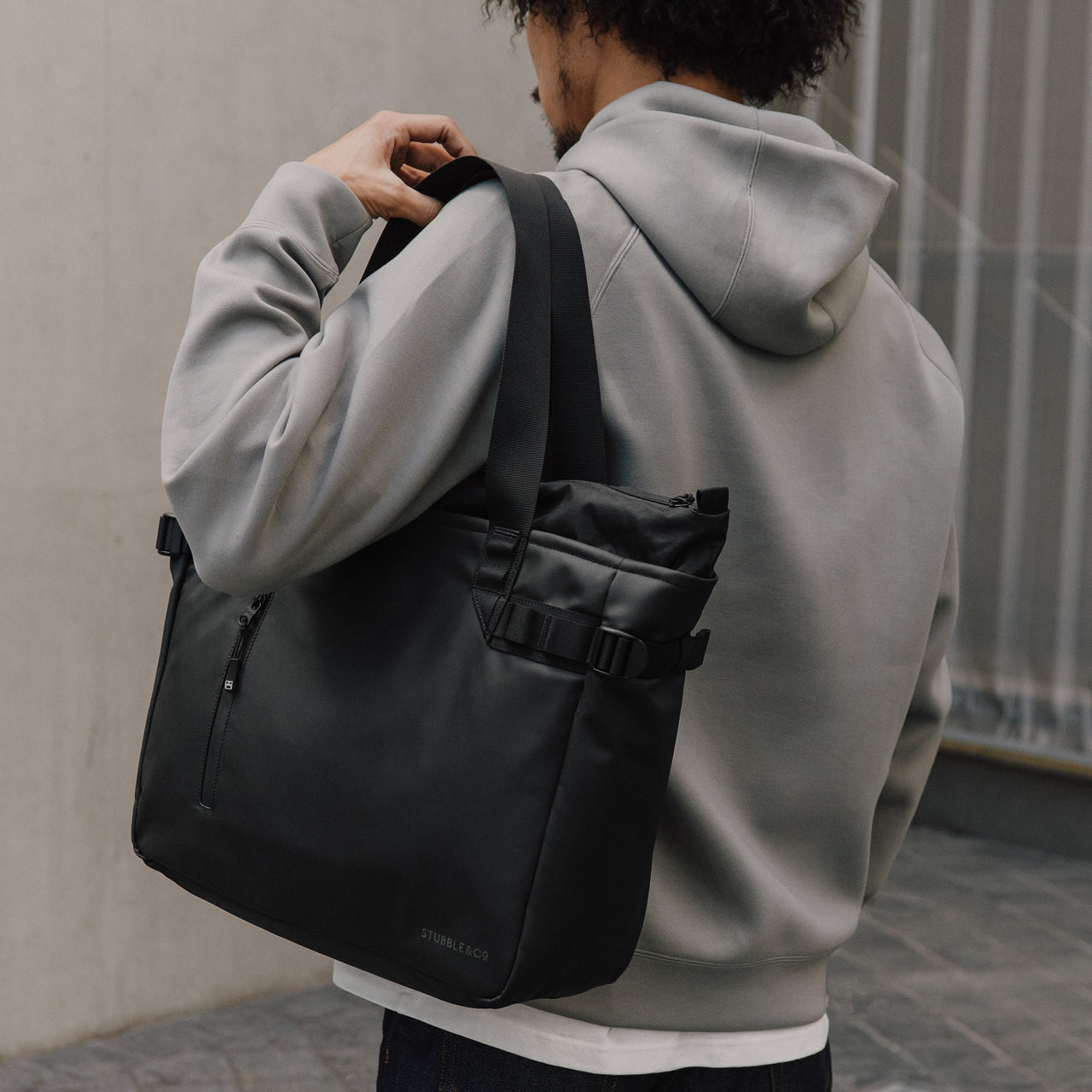 Person carrying The Tote Bag in All Black