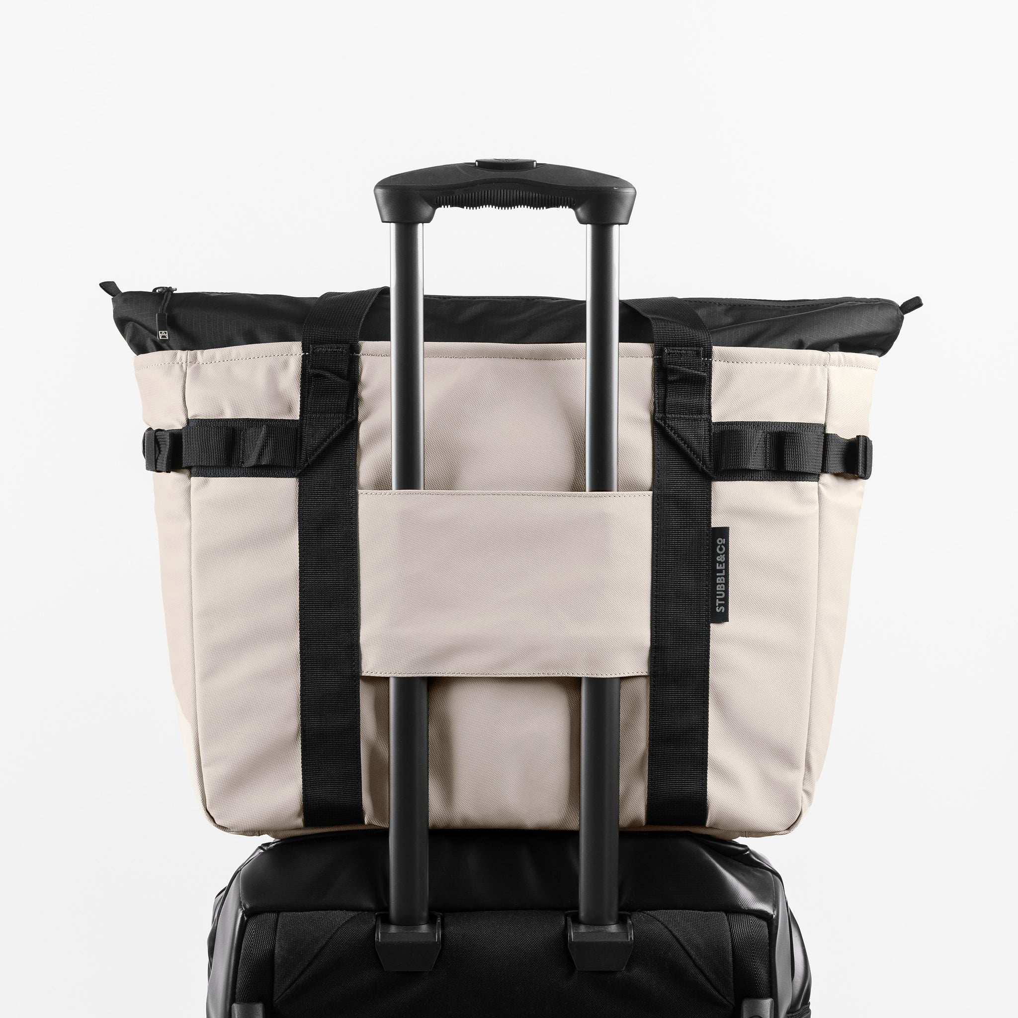 a studio shot of the back of Sand Tote Bag with the trolley sleeve