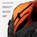 The Tote Bag in All Black inside compartments with the features annotated on