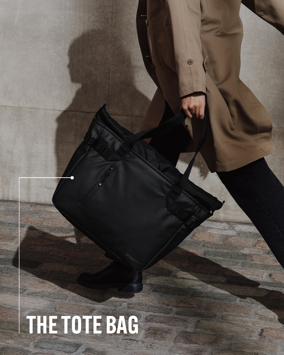 A woman holding a tote bag by her side with product name annotated