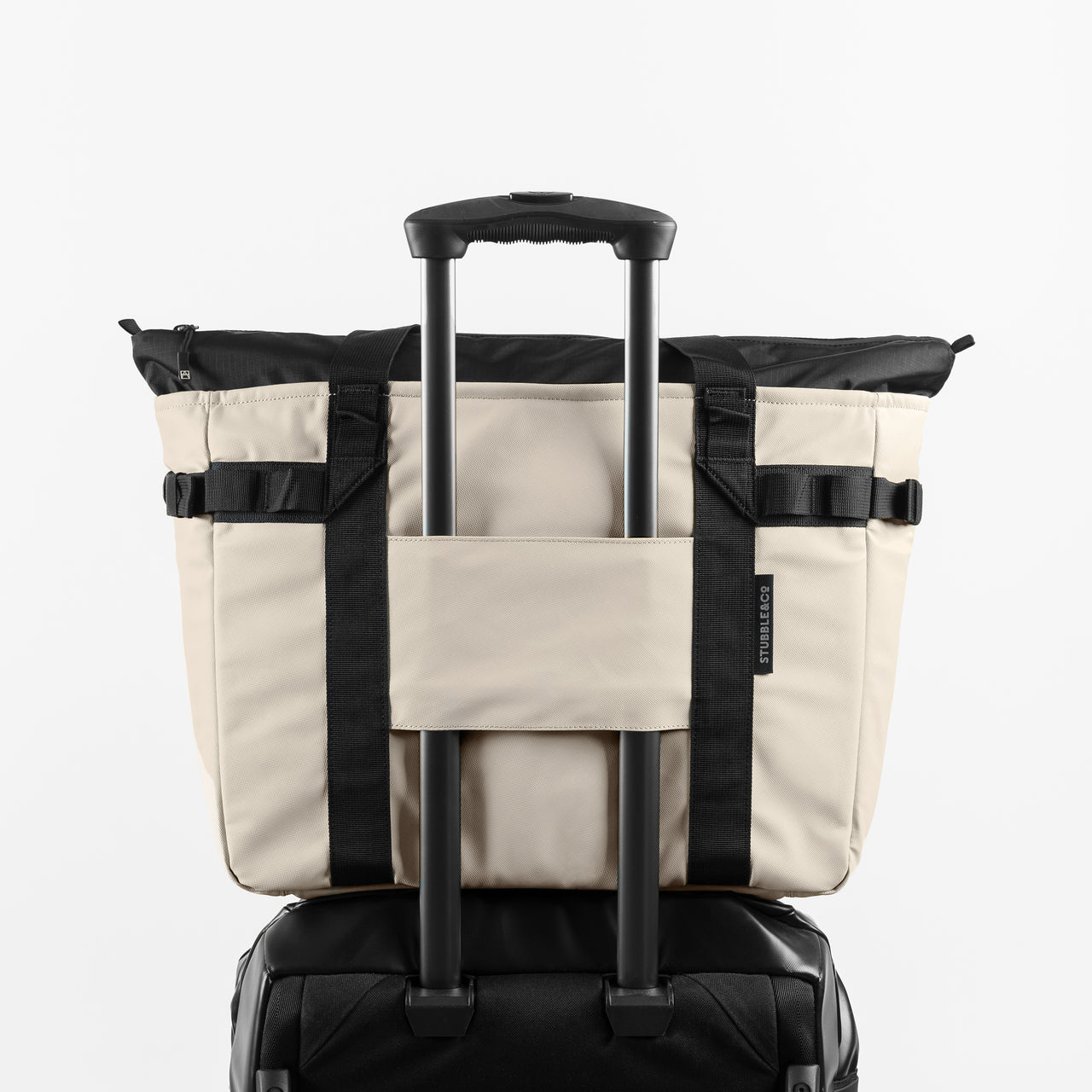 a studio shot of the back of Sand Tote Bag with the trolley sleeve