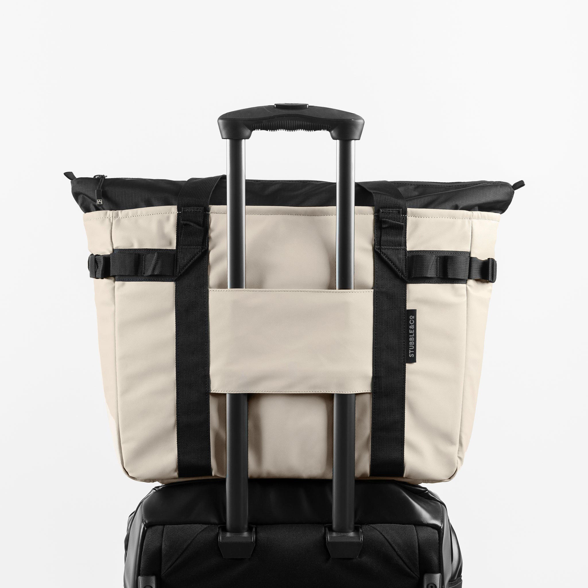 a studio shot of the back of Sand Tote Bag with the trolley sleeve