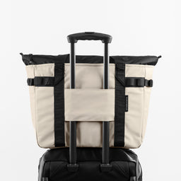 a studio shot of the back of Sand Tote Bag with the trolley sleeve