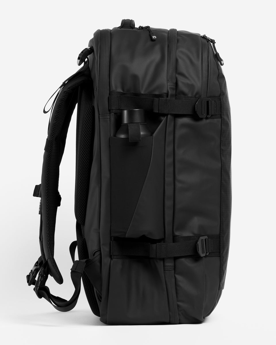 A studio shot showing the elasticated bottle pocket on the travel backpack 40l