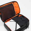 A studio shot of the clamshell packing of the Travel Backpack 40L in All Black