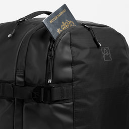 A studio shot of the top easy access pocket on the Travel Backpack 40L in All Black