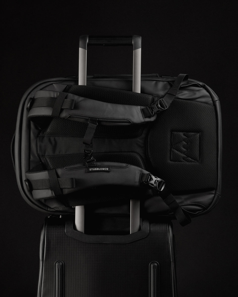 A studio shot showing the luggage sleeve of the travel backpack 40l