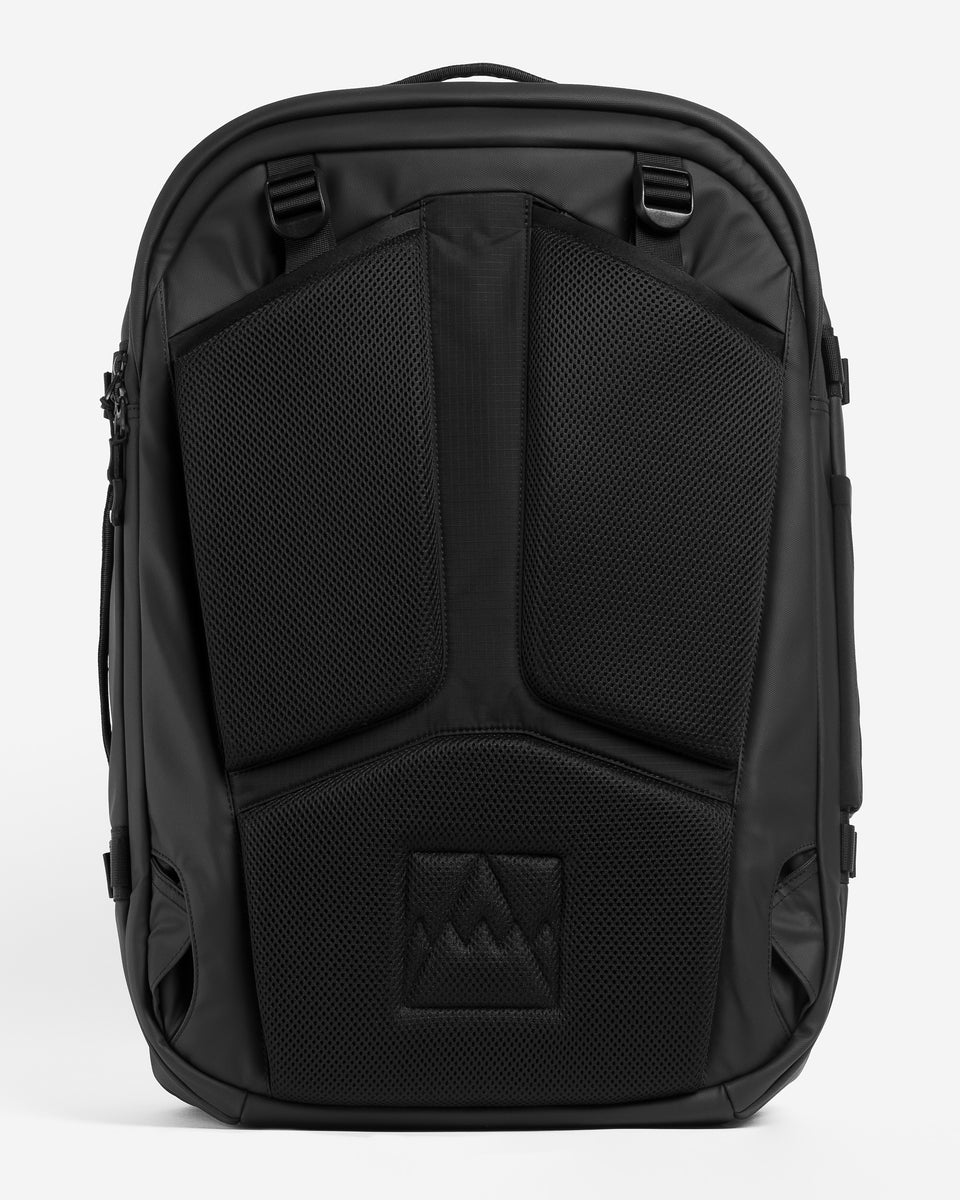 A studio shot showing the tuck-away straps on the travel backpack 40l