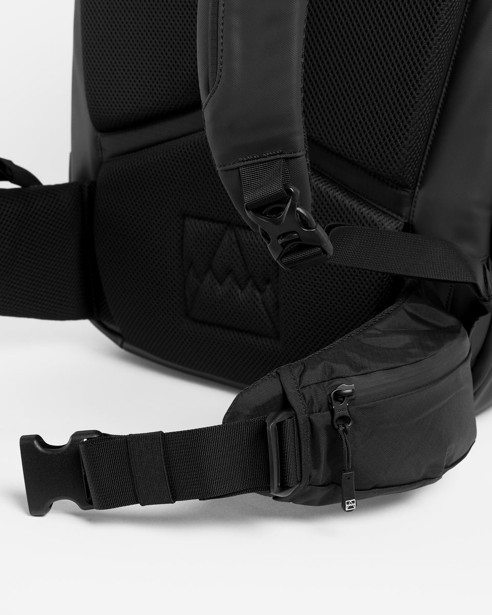 A studio shot showing the waist strap on the travel backpack 40l