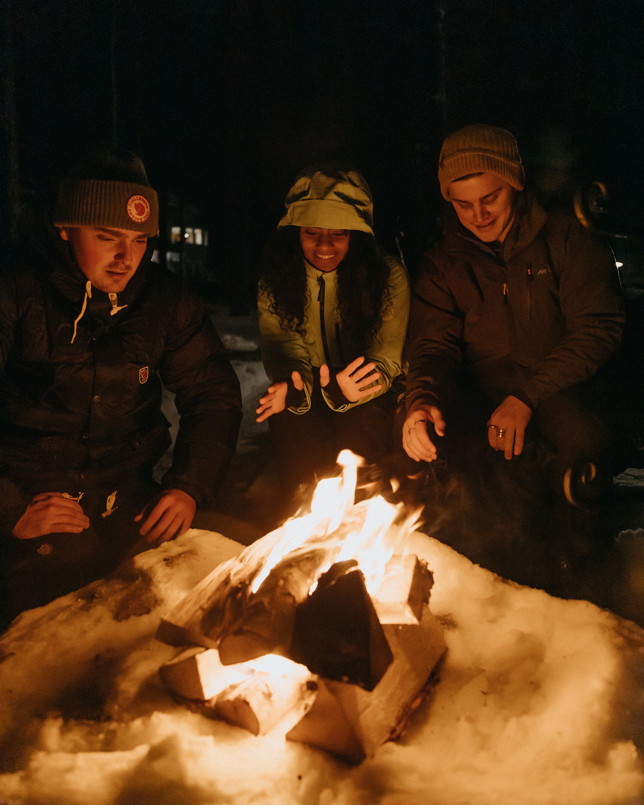 People sitting around a campfire in Finland