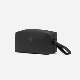 An All Black Wash Bag at an angle showing the ned loop handle, zip, waterproof material and reflective logo