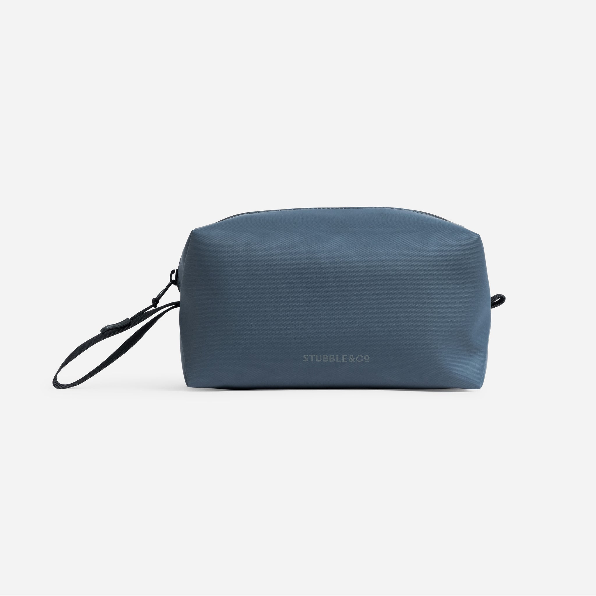 A studio shot of the back of the Tasmin Blue Wash Bag showing the reflective logo