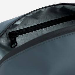 A close up studio shot of the interior pearl lining within the Tasmin Blue Wash Bag
