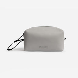 A studio shot of the back of a Concrete Wash Bag showing the reflective logo
