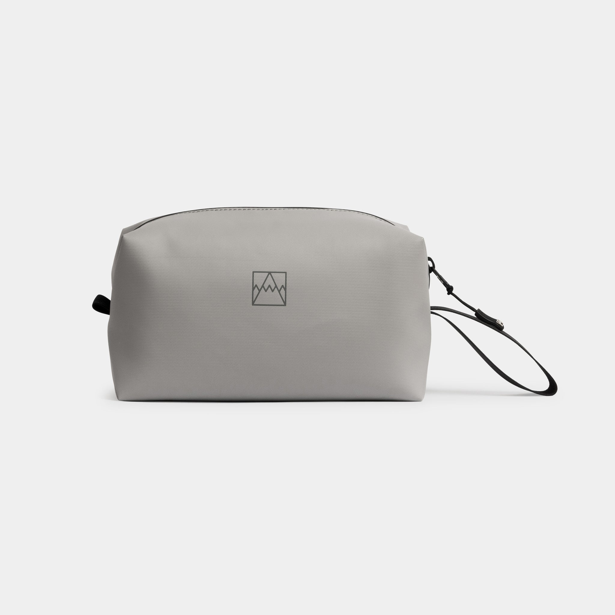 A studio shot of the side of a Concrete Wash Bag showing the reflective logo