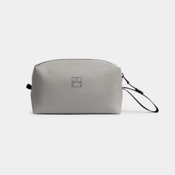 A studio shot of the side of a Concrete Wash Bag showing the reflective logo