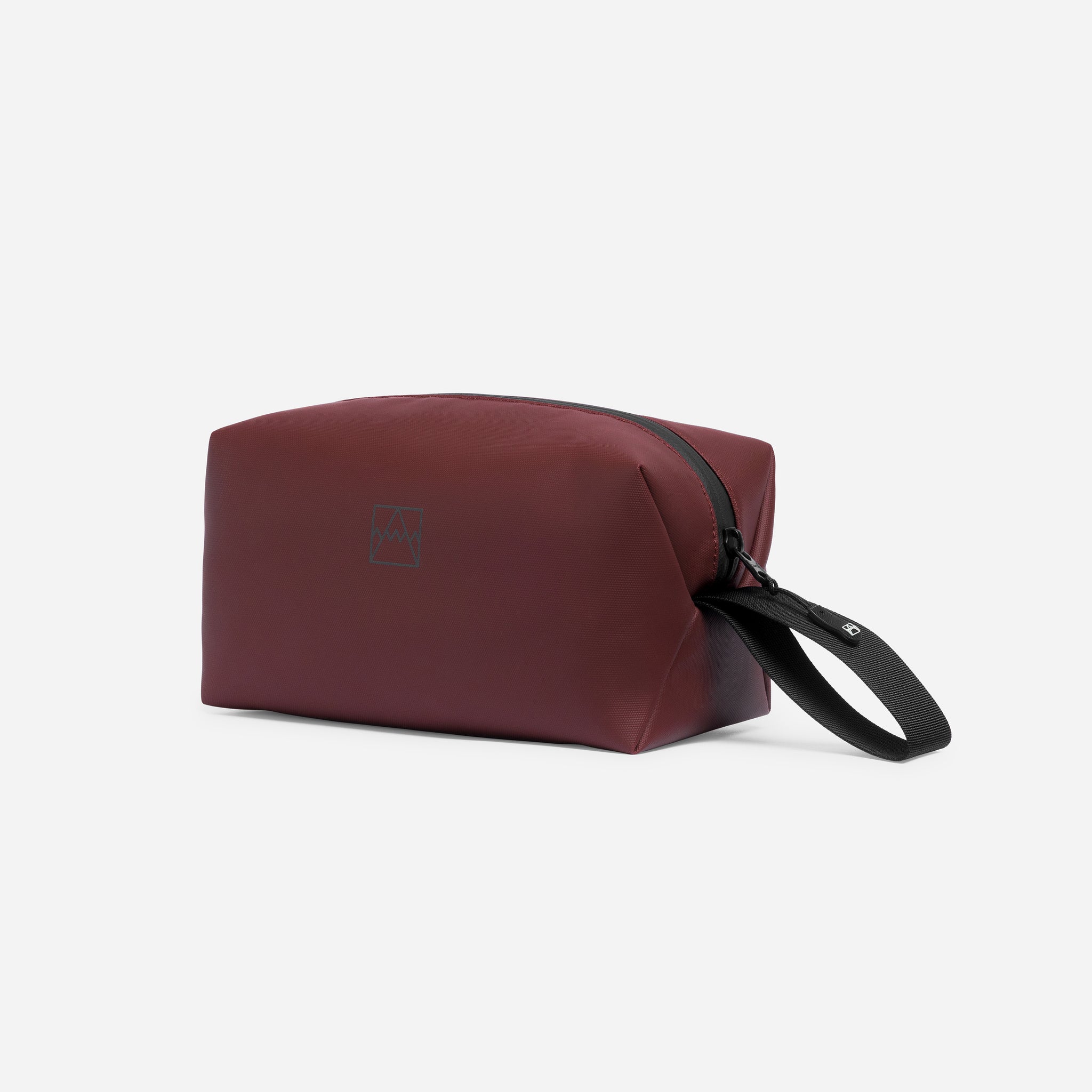 A studio shot of the Garnet Red Wash Bag showing the reflective logo