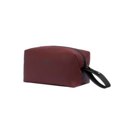 Garnet Red Wash Bag with a black zip and carry strap.