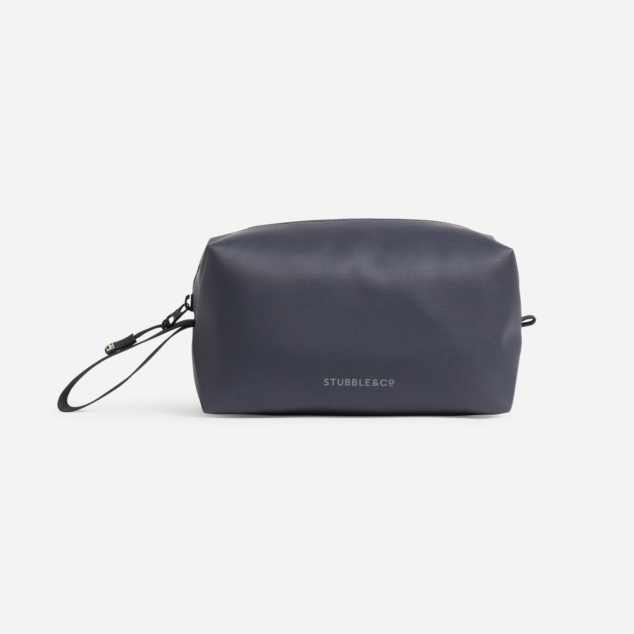 A studio shot of the back and reflective logo on the Midnight Blue Wash Bag