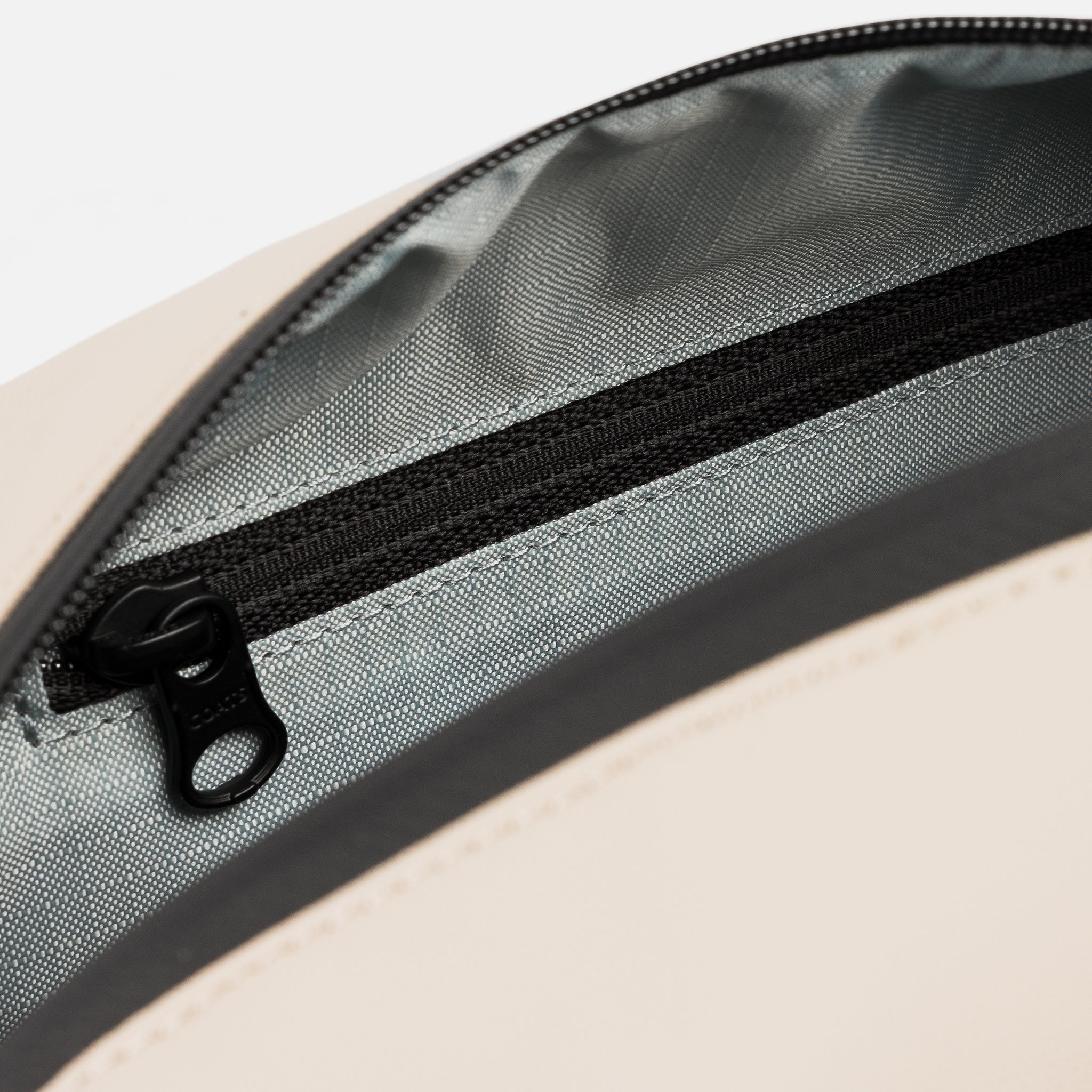 A studio shot of the interior pearl lining inside the Sand Wash Bag