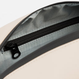 A studio shot of the interior pearl lining inside the Sand Wash Bag