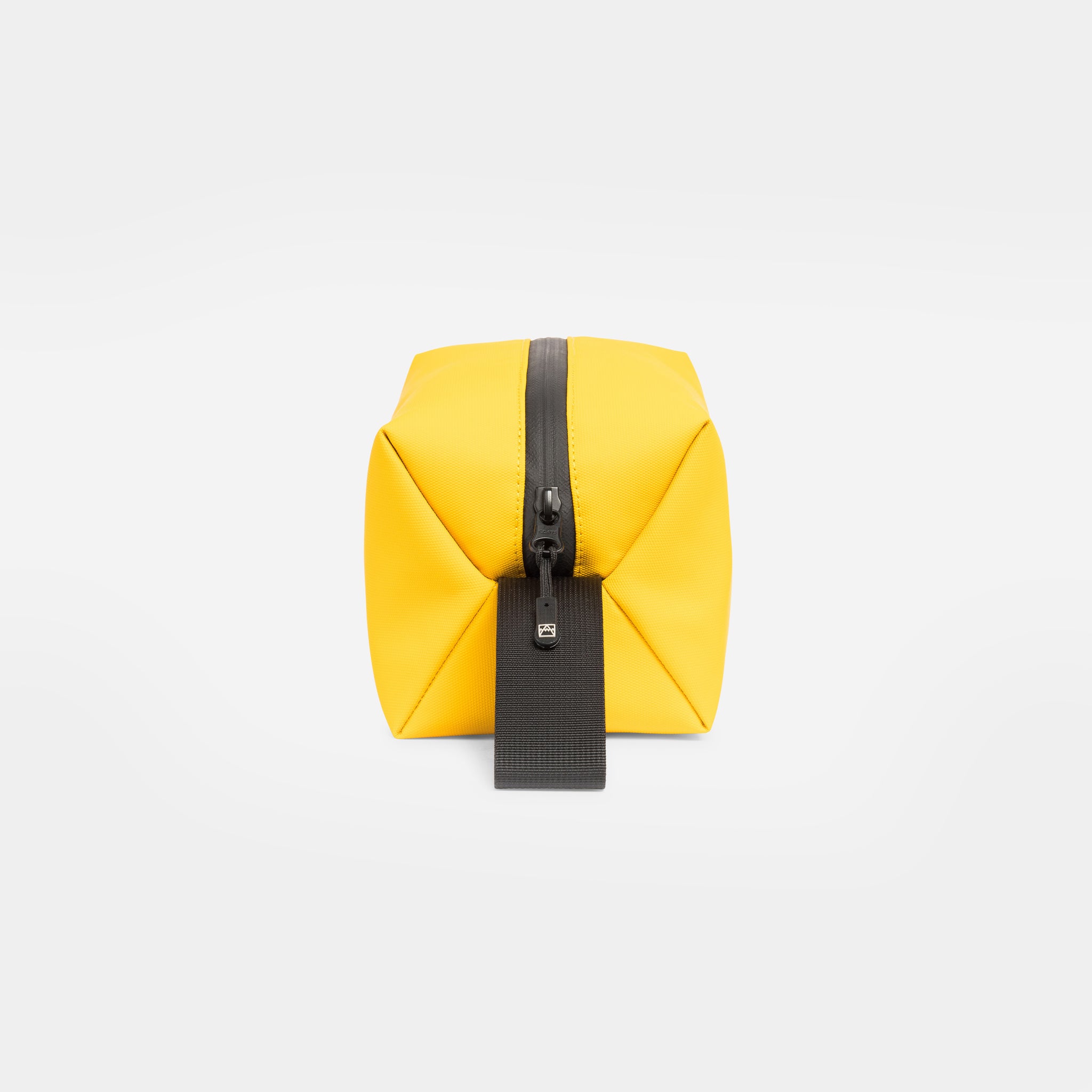 A studio shot of the end and zip on a Yellow Wash Bag