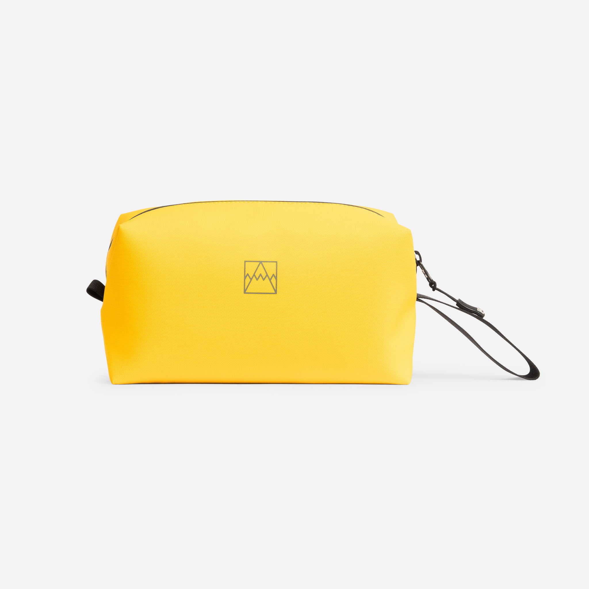 A studio shot of the side of the Yellow Wash Bag with the Stubble & Co logo very obvious