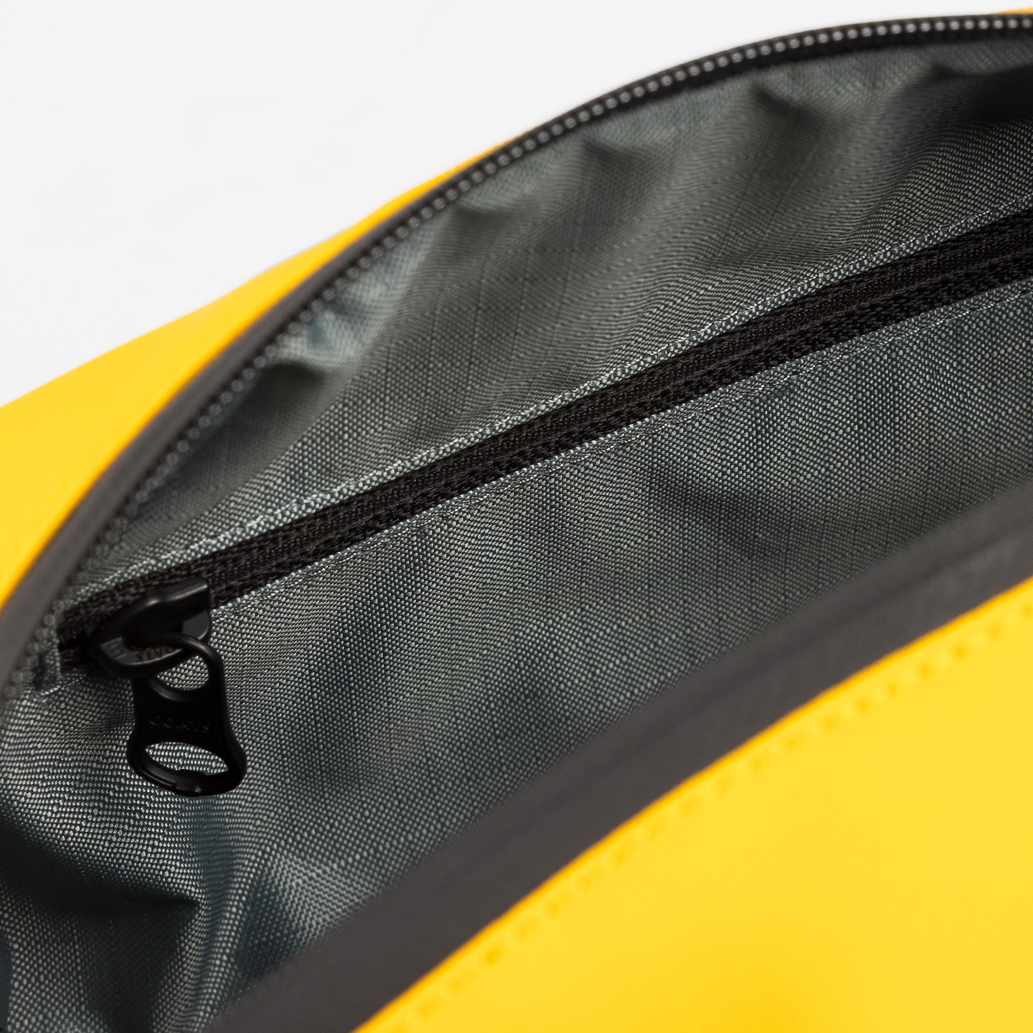 A studio shot of the interior blue lining of a Yellow Wash Bag