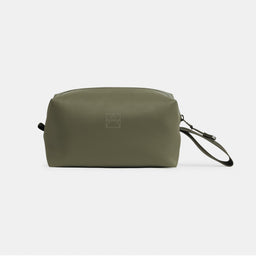 A studio shot of the front of the Urban Green Wash Bag showing the waterproof material, loop handle and reflective logo
