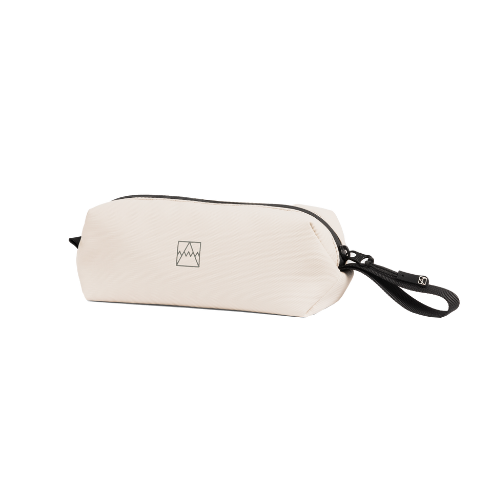 The Wash Bag Mini in Sand at a side angle