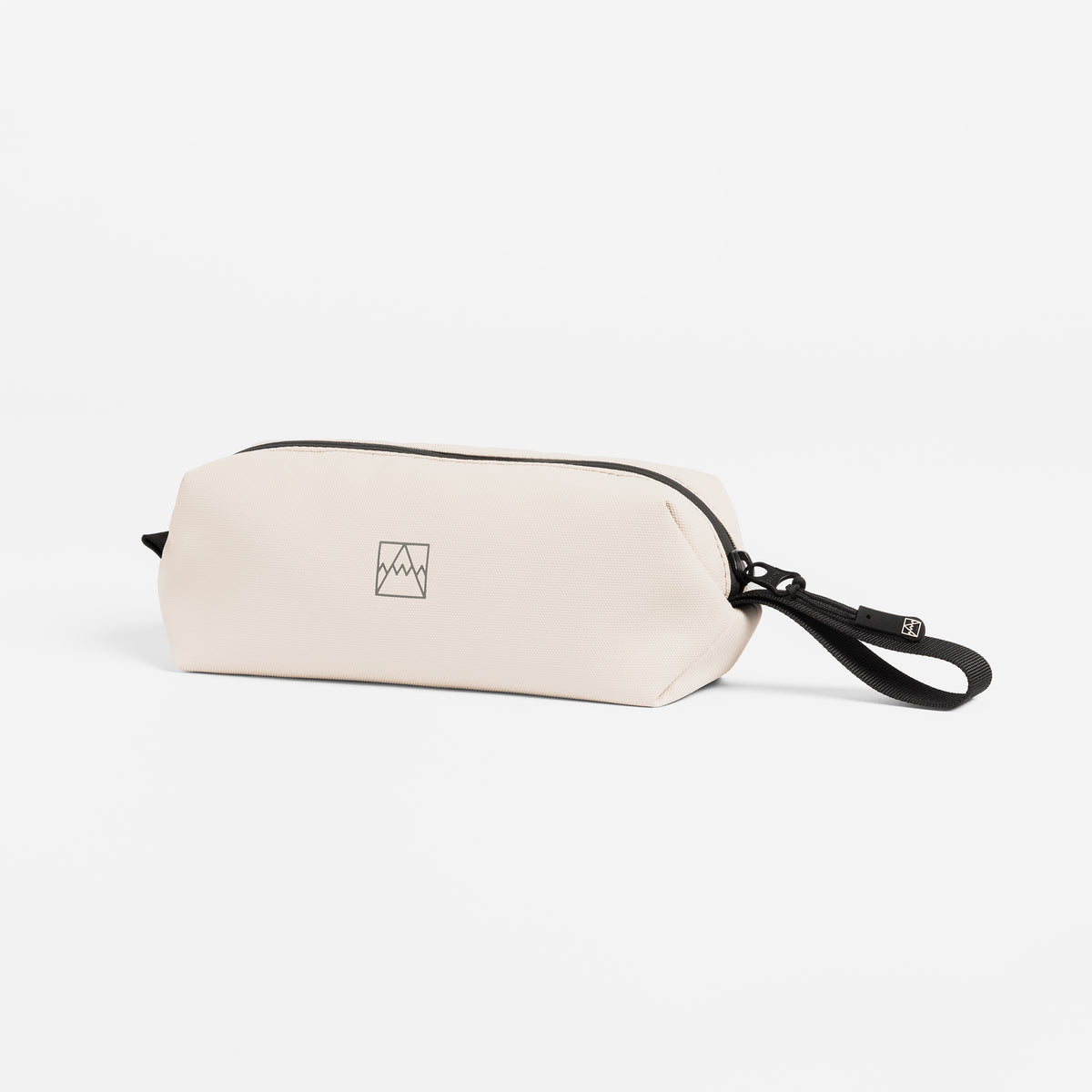 A studio shot of the side and loop handle of the pencil case in Sand