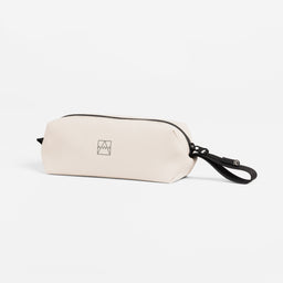 A studio shot of the side and loop handle of the pencil case in Sand