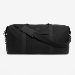 A studio shot of the side and shoulder strap on a Weekender 30l in All Black