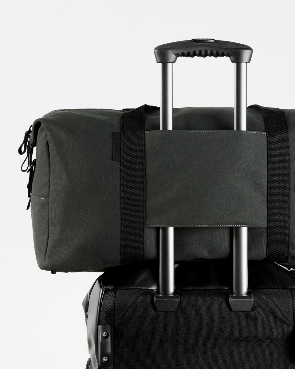 a studio shot of the trolley sleeve on the weekender duffel 30l