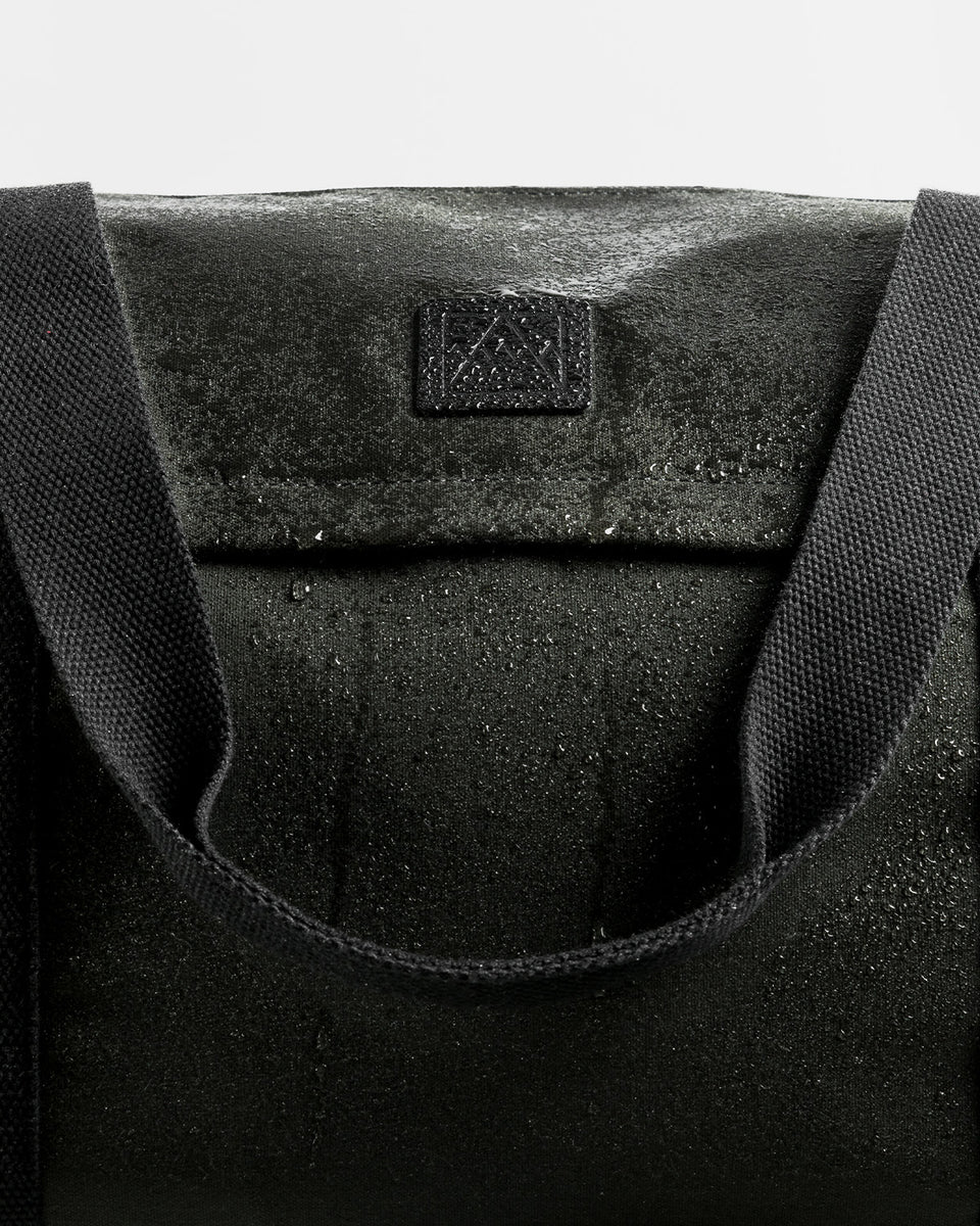A studio shot of the water-resistant material on a weekender duffel 30l