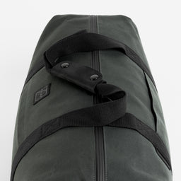 A studio shot of the leather grab handles on a Weekender 30L in Pirate