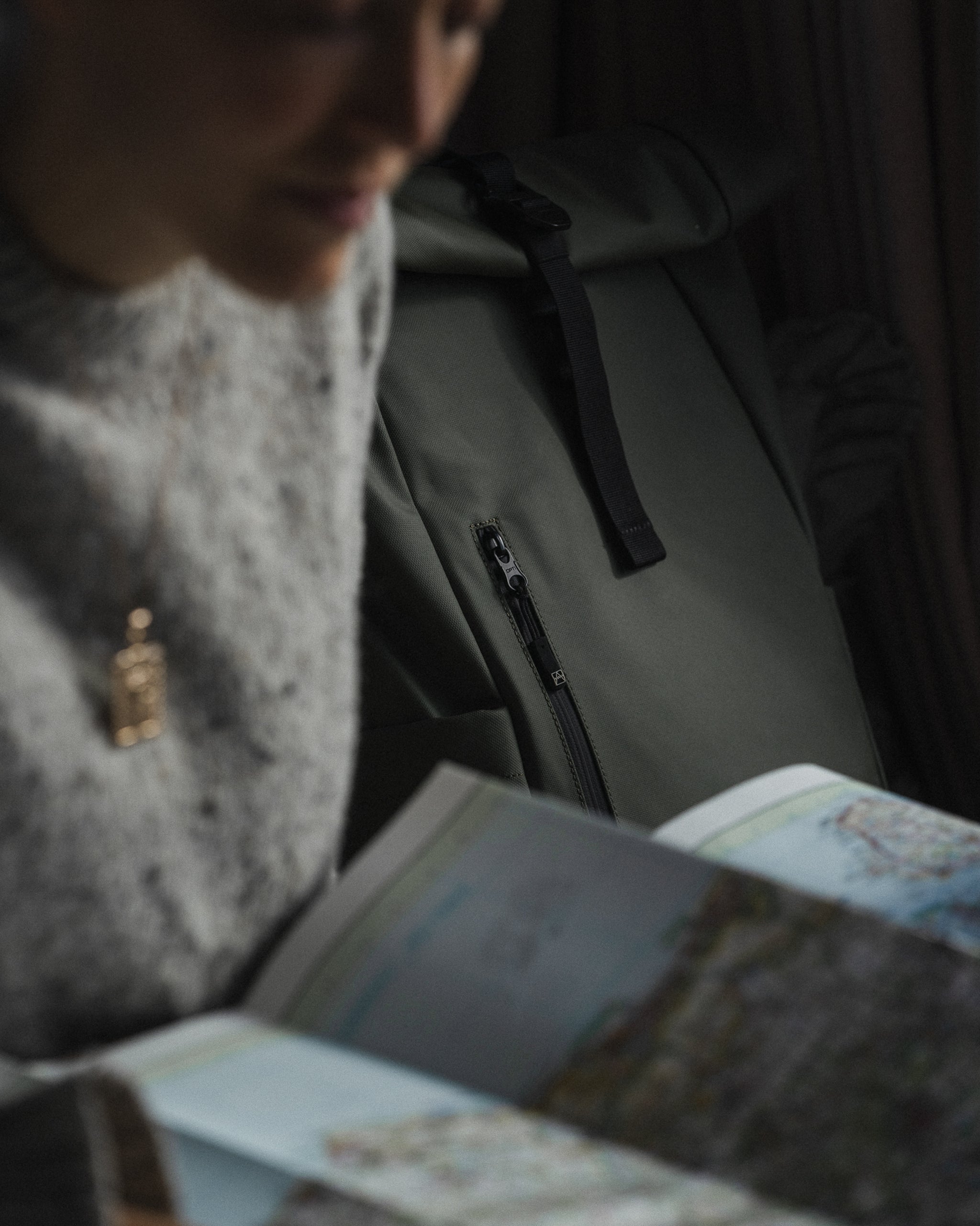 a woman looking at a map - the travel project blog