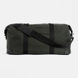 Product shot of The Weekender in All Black from the front, with the shoulder strap in front.
